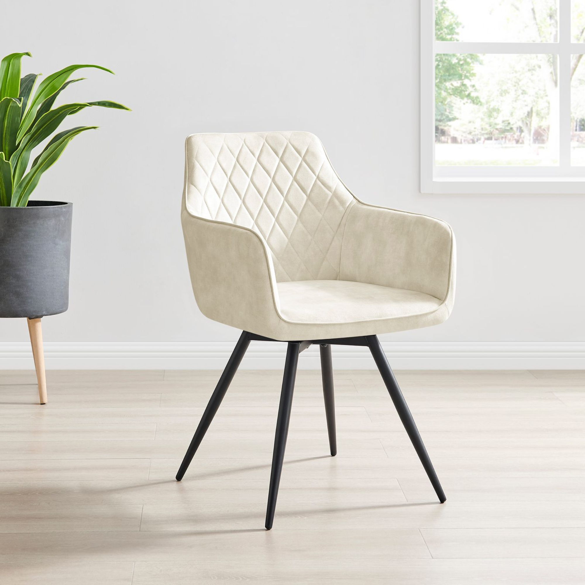 Ezra Cream Plush Velvet Swivel Dining Chair with Black Legs