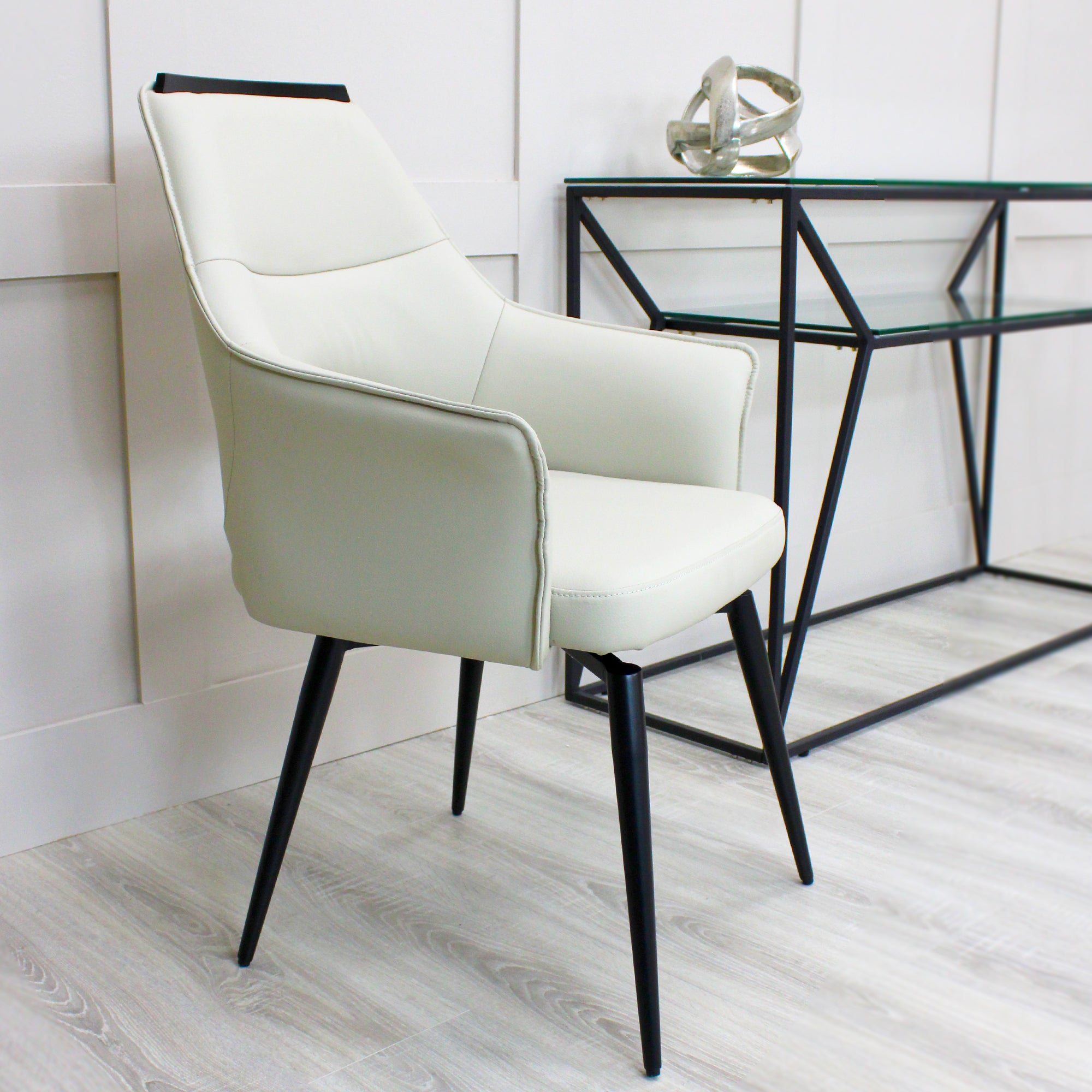 Esme Swivel Cream Leather Dining Chair Black Top Trim With Black Legs