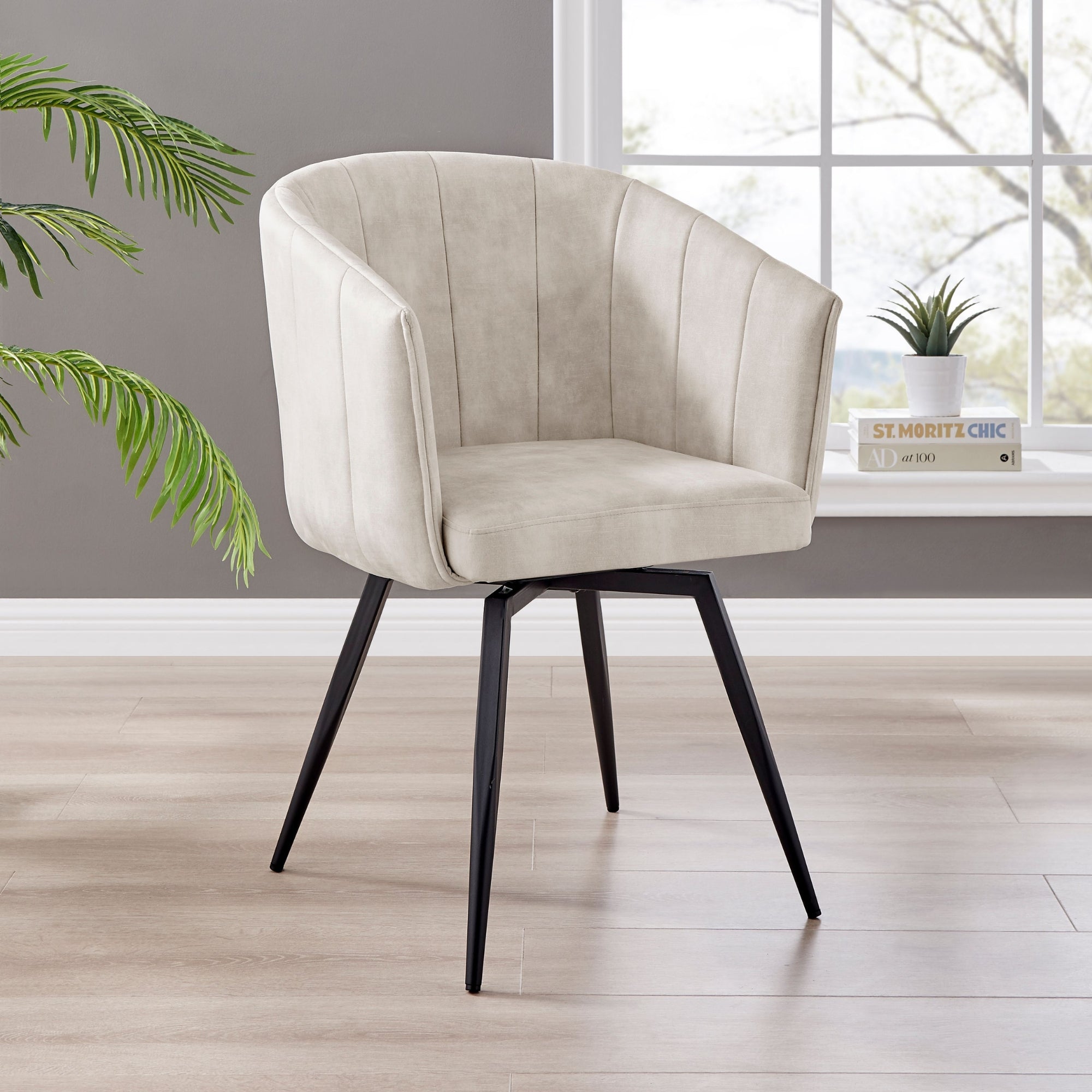 Arlo Swivel Cream Velvet Dining Chair With Black Legs